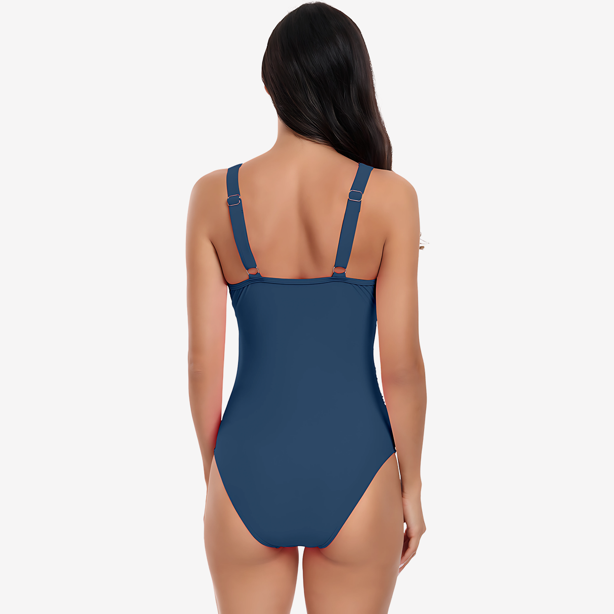 Back View of Model wearing a dusk blue luxury one-piece swimsuit with a plunging V-neckline, sheer mesh panels, and a ruched high-waist design from Intyra’s designer swimwear collection.