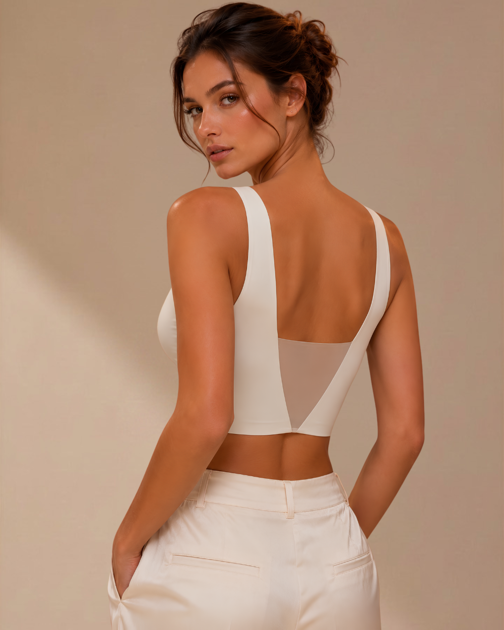 Back view of the Intyra Ivory Éclat Contour Top featuring adjustable straps and a smooth sculpted silhouette.