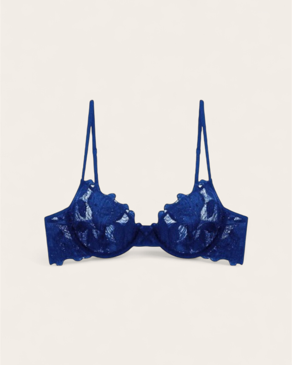 Celeste Azure Balconette Bra featuring sheer embroidered lace and midnight blue floral detailing on a white background.