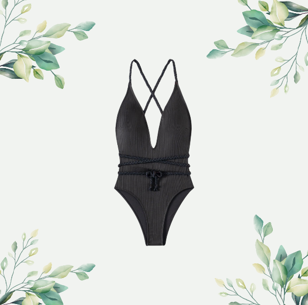 Elegant black one-piece swimsuit with braided straps and a belted waist, featuring a plunging neckline and stylish crisscross back design, set against a minimalist botanical background.