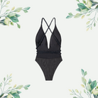 Elegant black one-piece swimsuit with braided straps and a belted waist, featuring a plunging neckline and stylish crisscross back design, set against a minimalist botanical background.