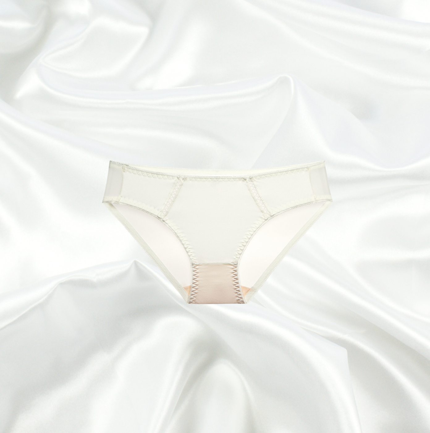 Champagne sheer bikini brief by Intyra with intricate mesh detailing and soft elastic waistband, designed in a one-size fit.