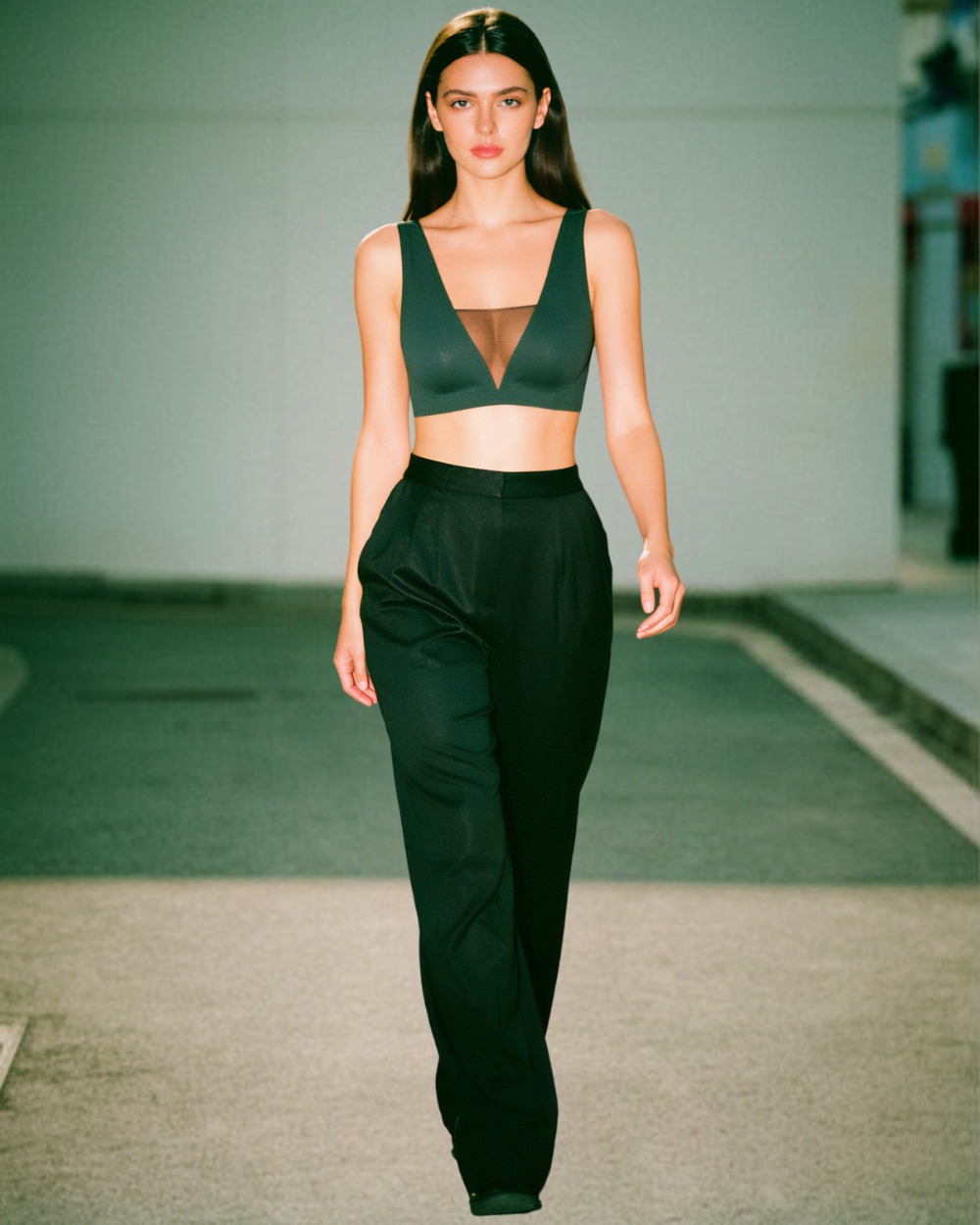 Model wearing the Intyra Black corset top and walking on the runway