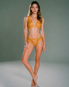 Model wearing the Intyra Golden Veil Lace lingerie set featuring elegant floral lace embroidery and sheer detailing.