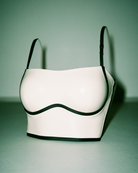 Intyra Ivory Contour Corset Top featuring contrast black piping and a structured square neckline displayed on a white background.