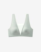 Intyra Mist Veil Contour Top in soft mist green featuring sheer mesh detailing and a sculpted contemporary silhouette on a white background.