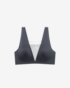 Intyra Onyx Allure Contour Top in black featuring sheer mesh detailing and a sculpted contemporary silhouette on a white background.