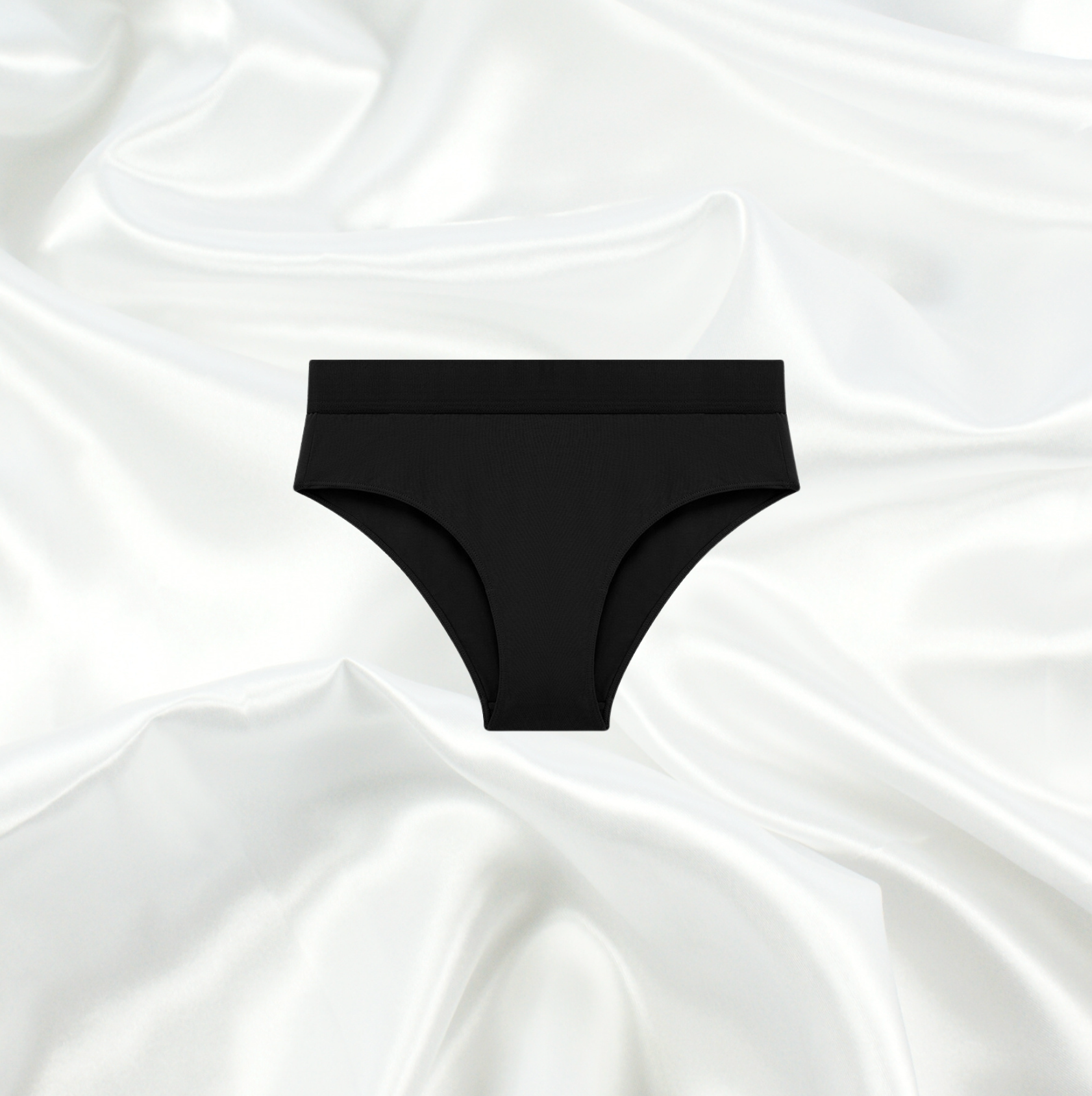 Seamless black bikini panty by Intyra, featuring a luxurious design on a satin background, perfect for everyday comfort and elegance