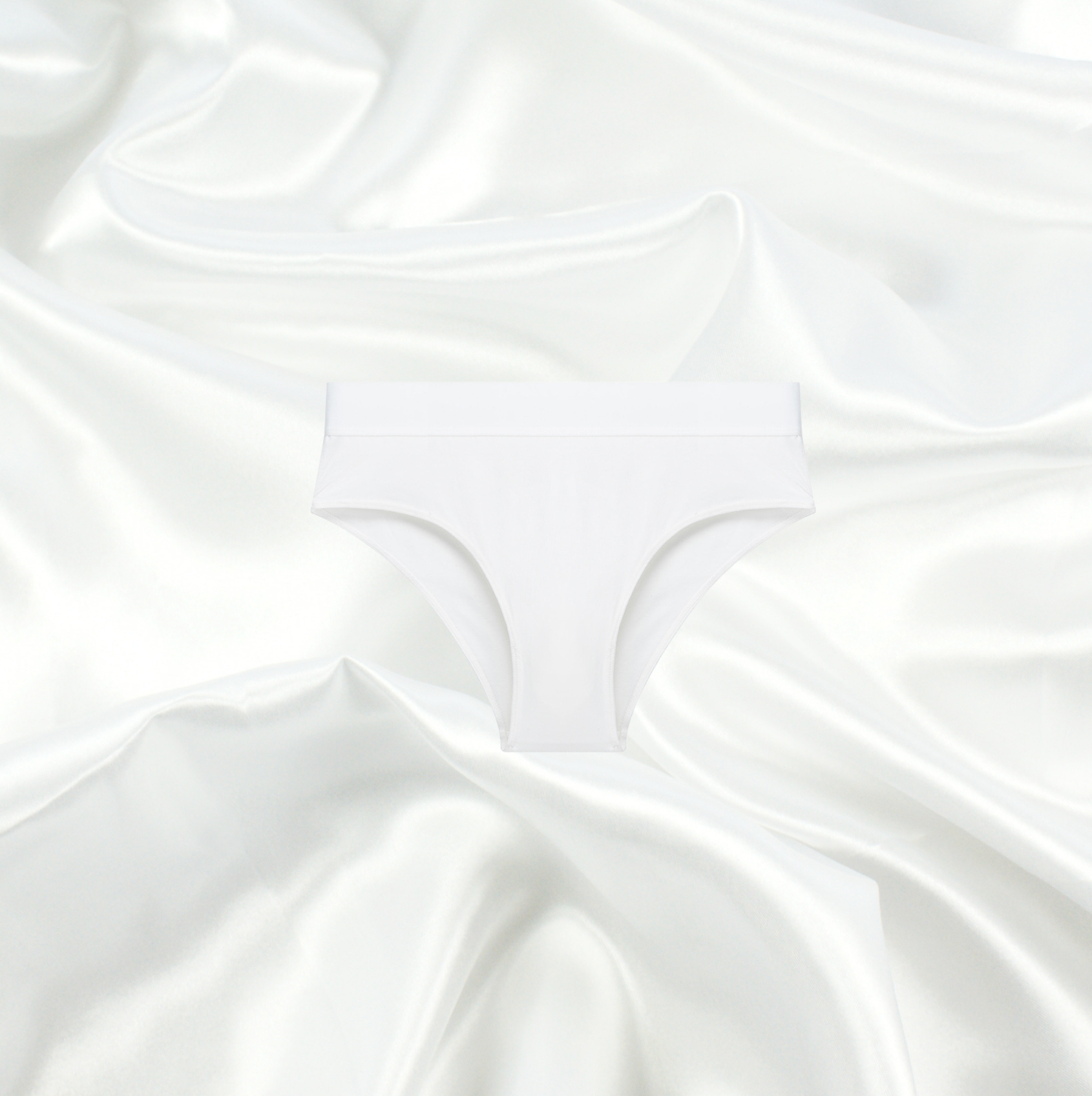 White seamless brief by Intyra, designed for a smooth, invisible fit under clothing, offering ultimate comfort and luxury