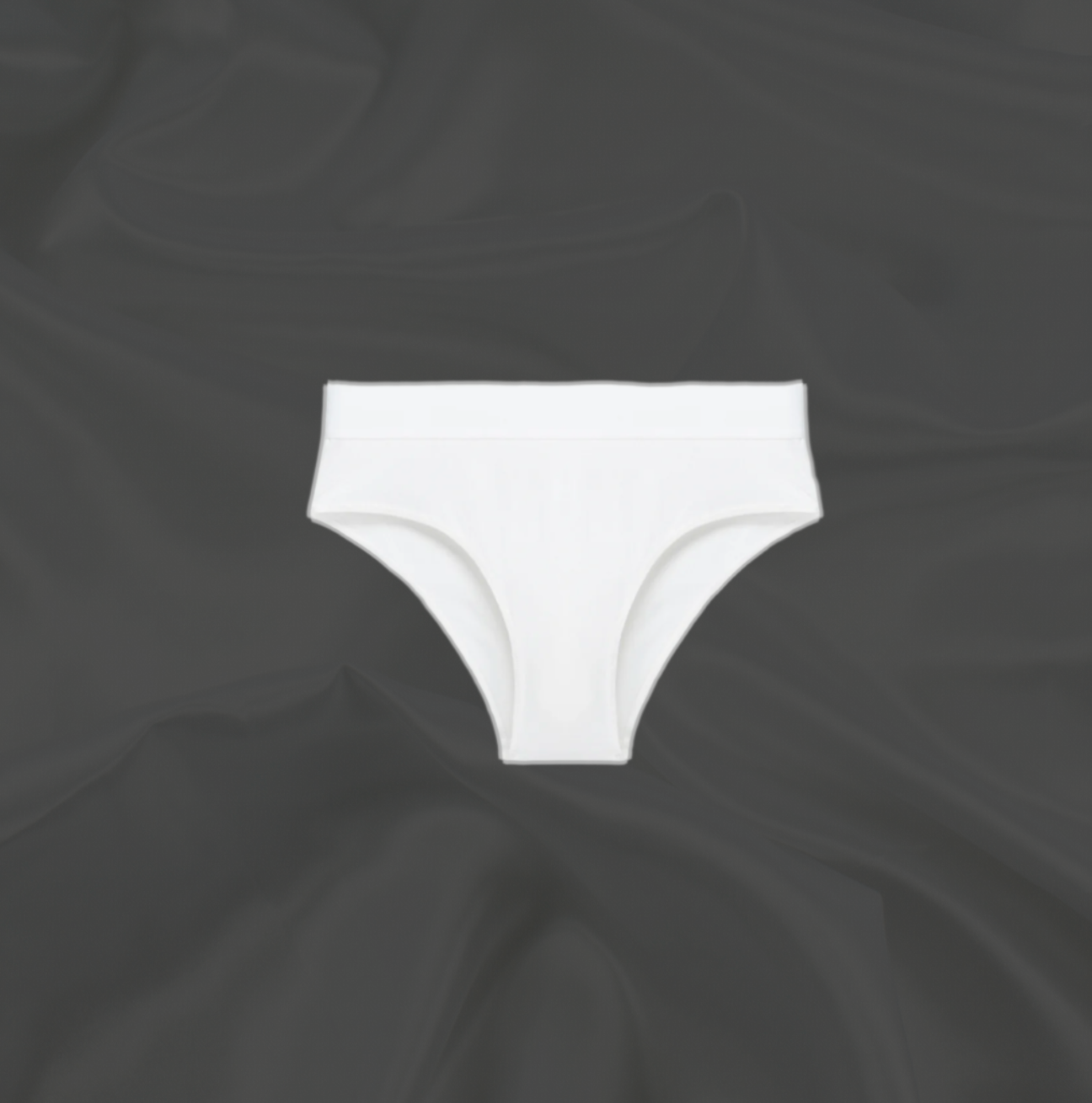 White seamless brief by Intyra, designed for a smooth, invisible fit under clothing, offering ultimate comfort and luxury