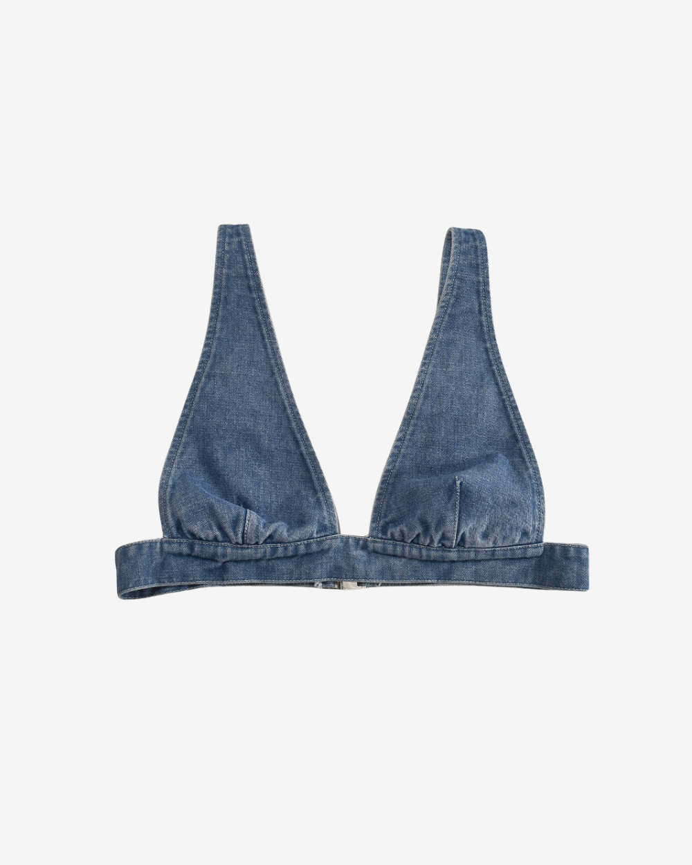 Denim Devil Corset Bra Top in soft-washed denim featuring a sculpted silhouette and plunge neckline on a white background.