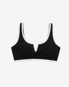 Iconic Riviera Black Bikini Top featuring a statement V-notch neckline and elegant white contrast trim on a white background.