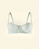 Luxury Intyra Mint Serenity floral lace bra in soft mint green displayed against an elegant coloured background.