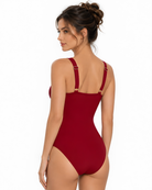 Back view of model wearing the Ruby Allure One-Piece styled for luxurious tropical resortwear.