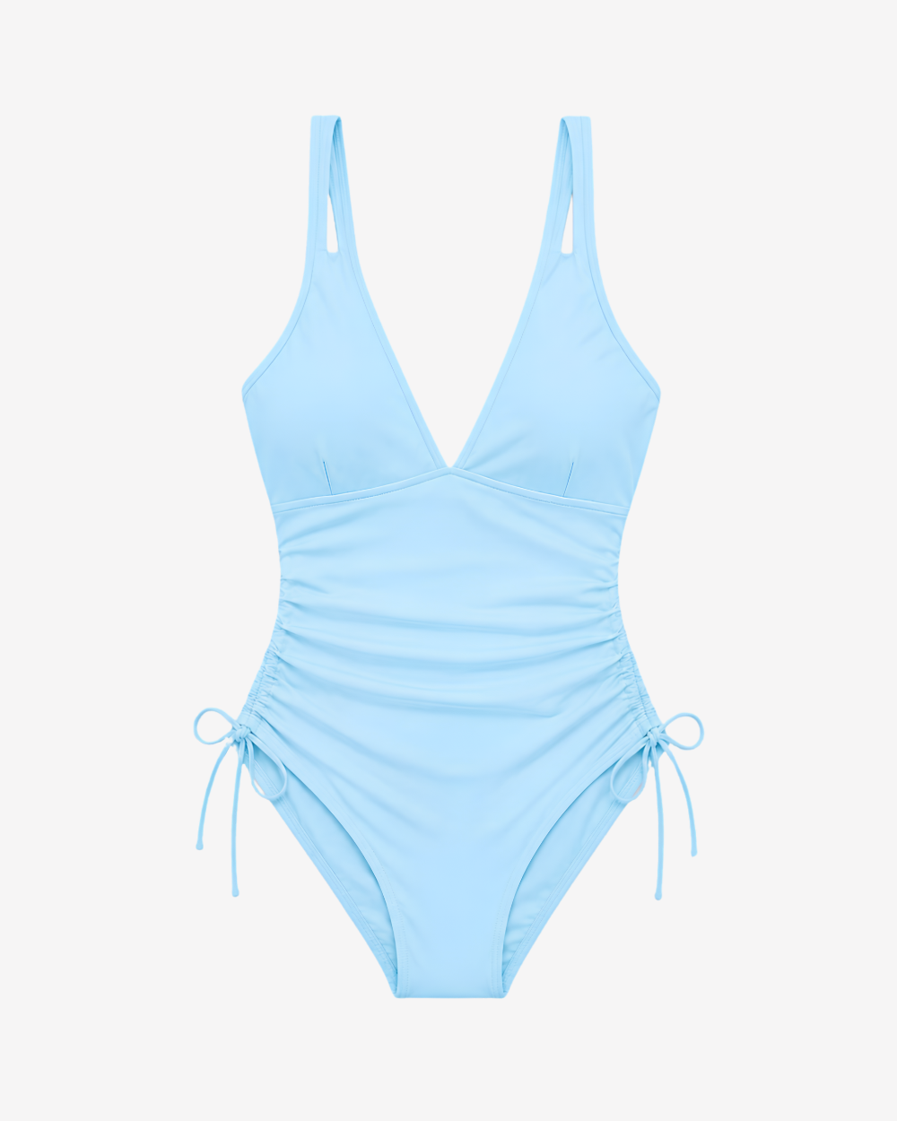 Front view of the Skyline Tranquility One-Piece Swimsuit in pastel blue featuring a deep V-neckline and ruched side detailing on white background.