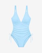 Front view of the Skyline Tranquility One-Piece Swimsuit in pastel blue featuring a deep V-neckline and ruched side detailing on white background.