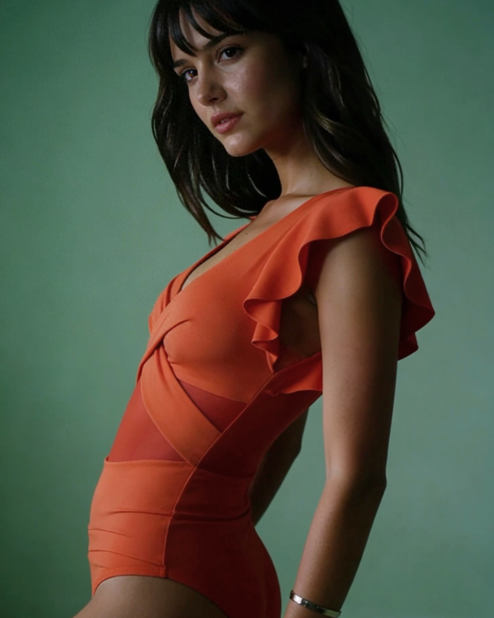 Close-up of the feminine flutter sleeve detailing on the Sunset Glow One-Piece swimsuit.