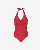 Product shot of Velvet Rouge Halter Swimsuit in a rich rouge red hue featuring an elegant crossover silhouette and sculpting ruched waist.